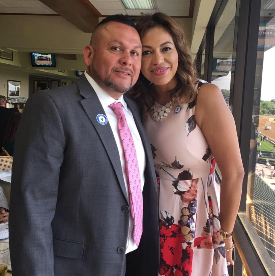 electrostatic painting owner, Felix Espinoza and his wife at Keeneland in lexington ky