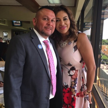 the owner of Electrostatic Painting, Felix Espinoza, and his wife at Keeneland race track in Lexington ky